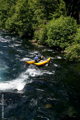 white water river rafting in a pontoon boat
