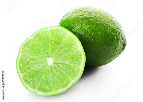 Sliced fresh limes isolated on white