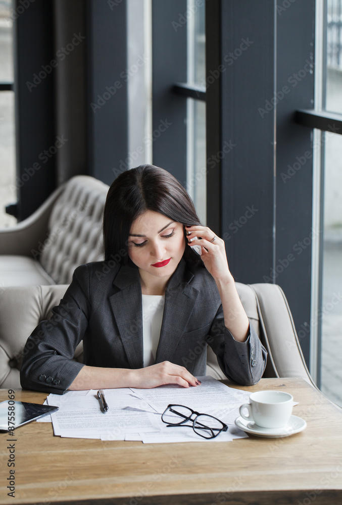 Pretty business lady having a conversation with a client concern Pretty business lady having a conversation with a client concern