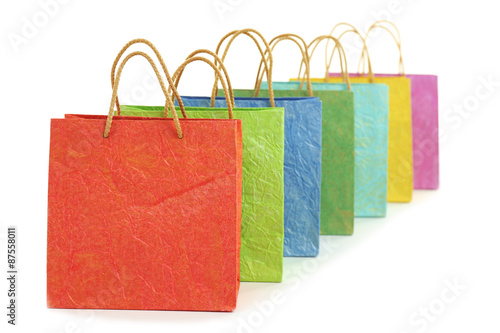 Colorful shopping paper bags isolated on white