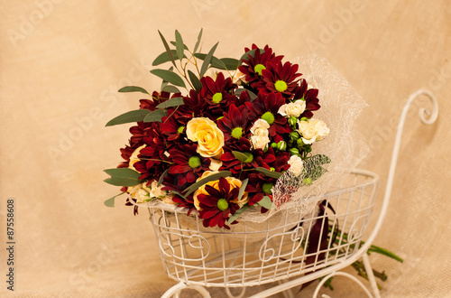 a bouquet of flowers on a background of burlap