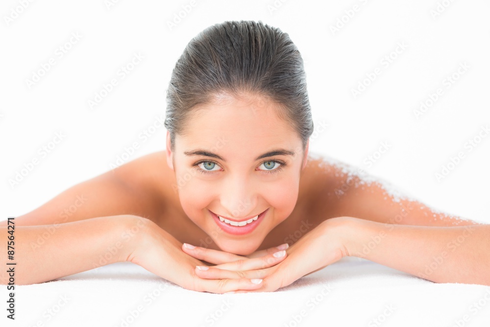 Portrait of a beautiful brunette enjoying a salt scrub treatment Portrait of a beautiful brunette enjoying a salt scrub treatment