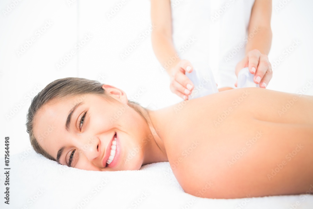 Beautiful brunette with vacuum cups on her back Beautiful brunette with vacuum cups on her back