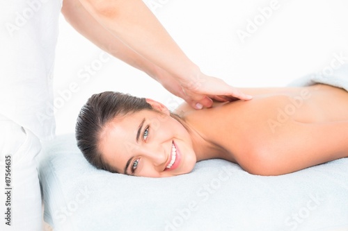 Pretty brunette enjoying a massage