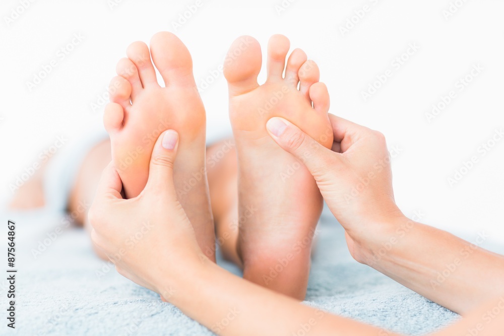 Close-up of a woman receiving foot massage Close-up of a woman receiving foot massage