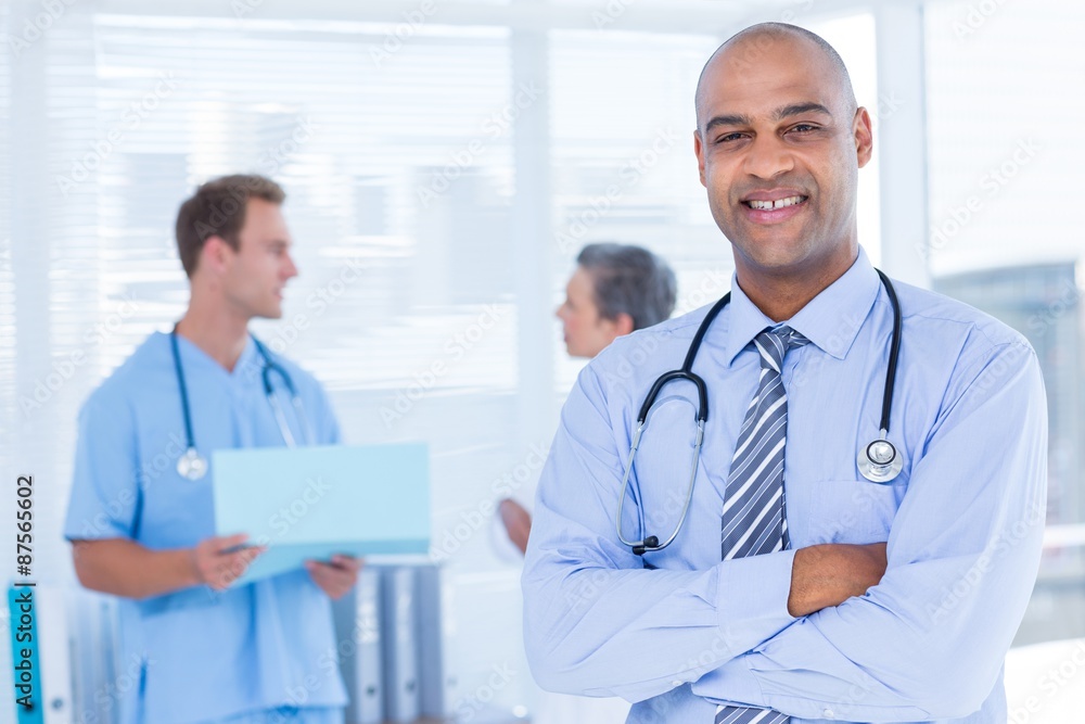 Smiling doctor looking at the camera Smiling doctor looking at the camera