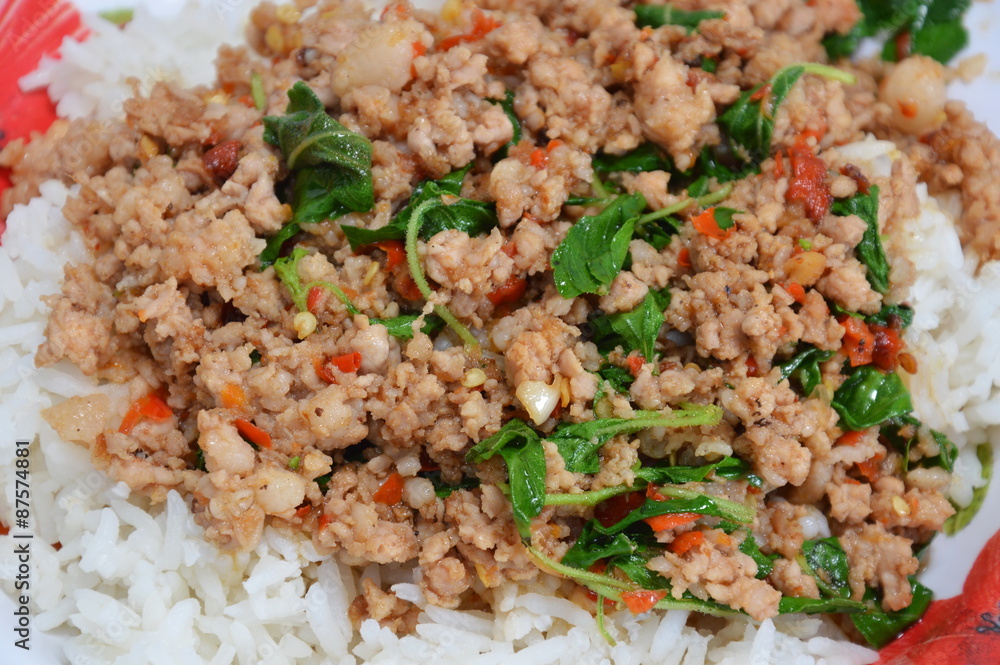 spicy stie fried pork chop with basil leaf and chili on rice spicy stie fried pork chop with basil leaf and chili on rice