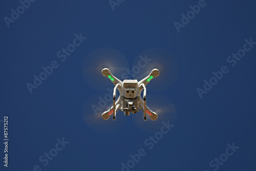 Quadrocopter Drone - UAV - flying in the sky - camera © philippe montembaut