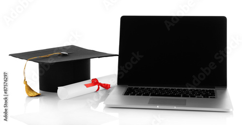 Graduation cap with laptop and diploma isolated on white
