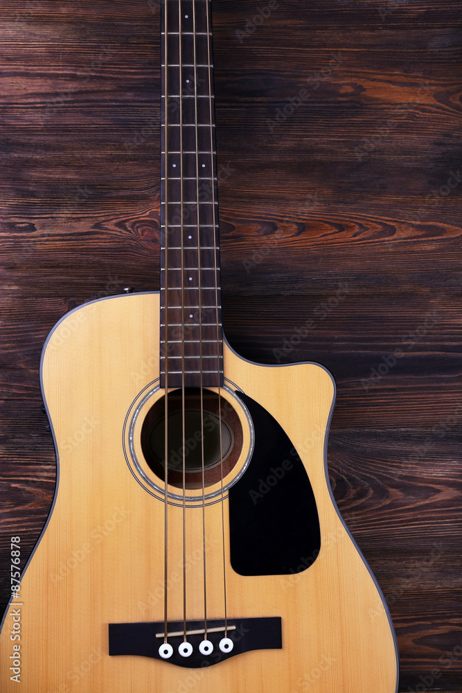 Fototapeta premium Acoustic guitar on wooden background