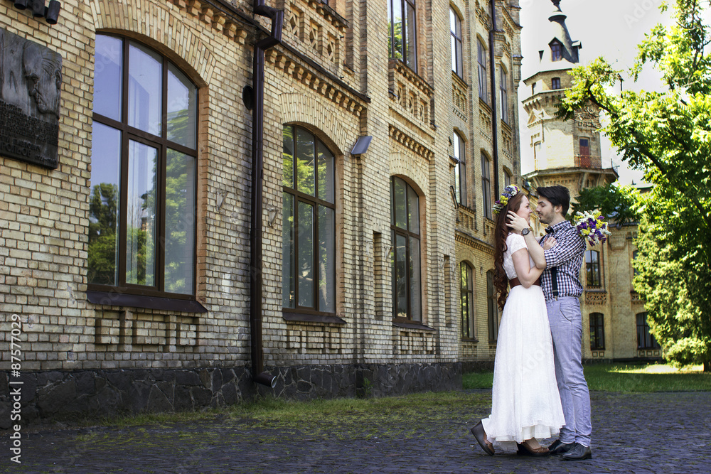 Bride and groom in beautiful decor with heart. Wedding beautiful couple in love Bride and groom in beautiful decor with heart. Wedding beautiful couple in love