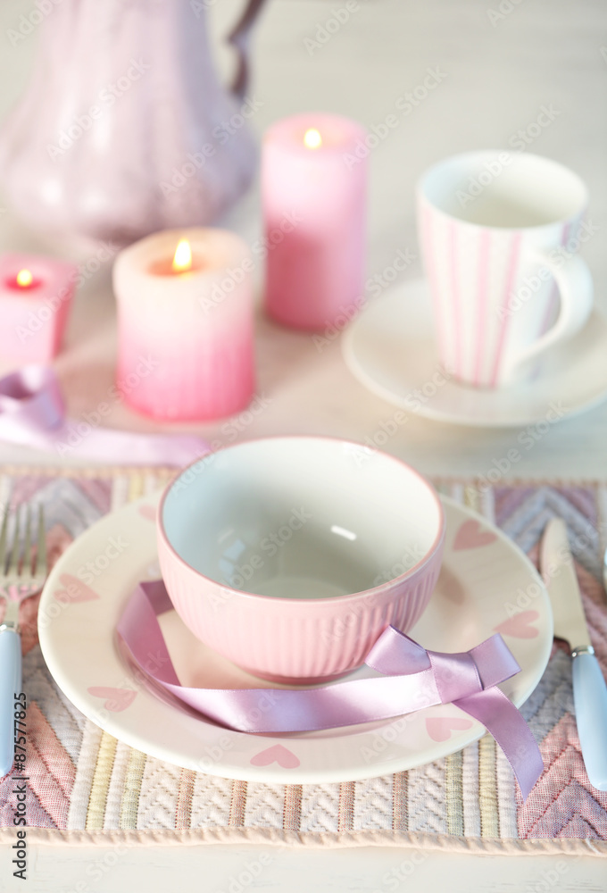 Beautiful holiday table setting in pink color Beautiful holiday table setting in pink color