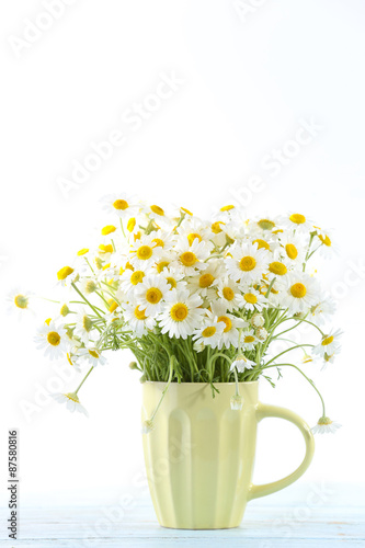 Wallpaper Mural Beautiful bouquet of daisies in cup on light background Torontodigital.ca