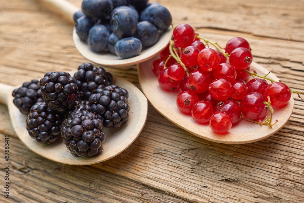 spoons with different berries spoons with different berries