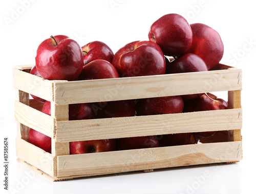 Red apples in wooden crate isolate on white