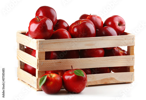 Red apples in wooden crate isolate on white