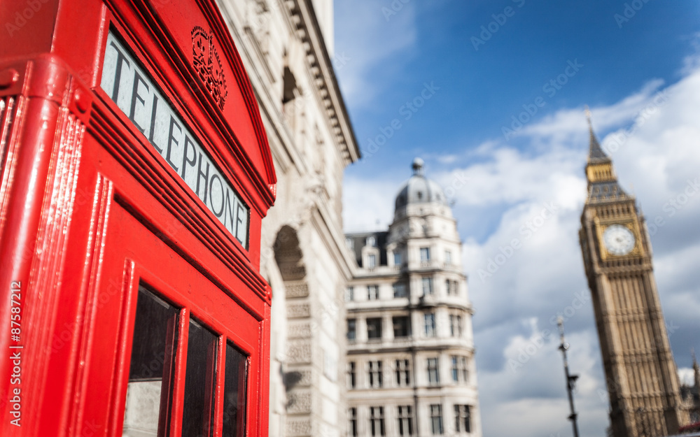 London phone box. Detail of an iconic red British telephone box with Big Ben visible in the background. London phone box. Detail of an iconic red British telephone box with Big Ben visible in the background.