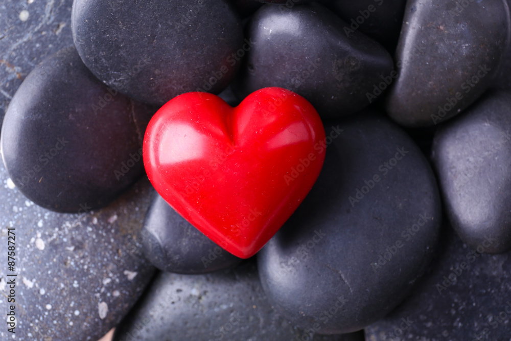 Red heard over pebbles background Red heard over pebbles background