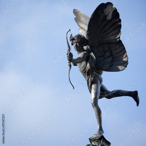 Statue of Eros, Piccadilly Circus, London. A low angle view of the familiar statue of Eros in Piccadilly Circus, London. photo