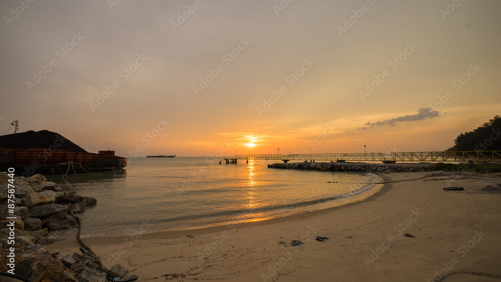 beautiful sunset at beach with jetty. Malacca, Malaysia