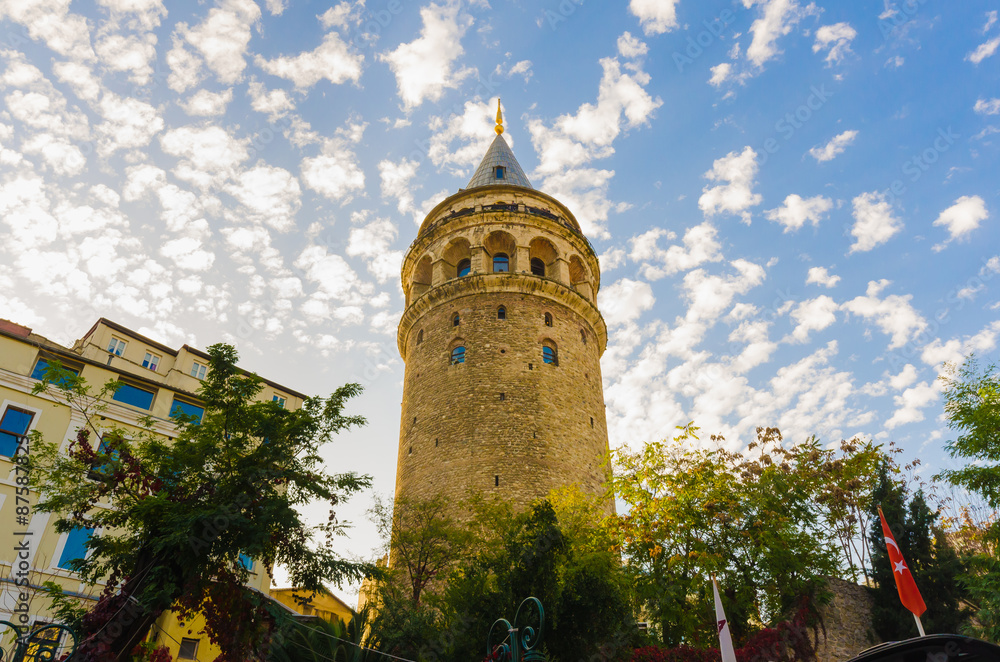 Historical Galata Tower with cloudy blue sky, Istanbul, Turkey