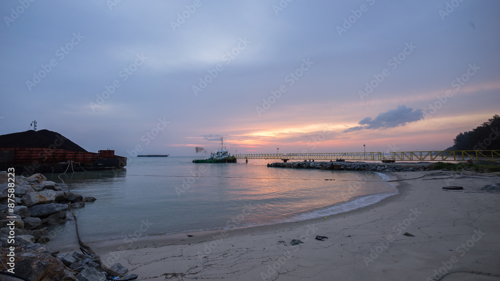 beautiful sunset at beach with jetty. Malacca, Malaysia