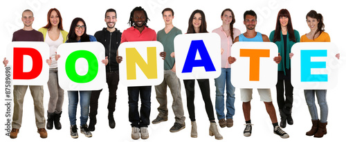 Group of young multi ethnic people holding word donate money don photo