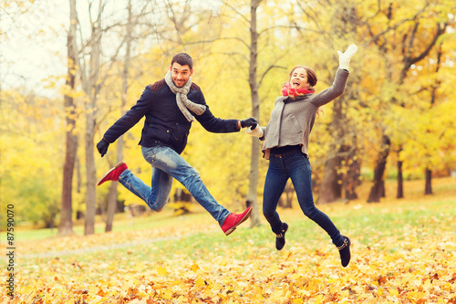 smiling couple having fun in autumn park