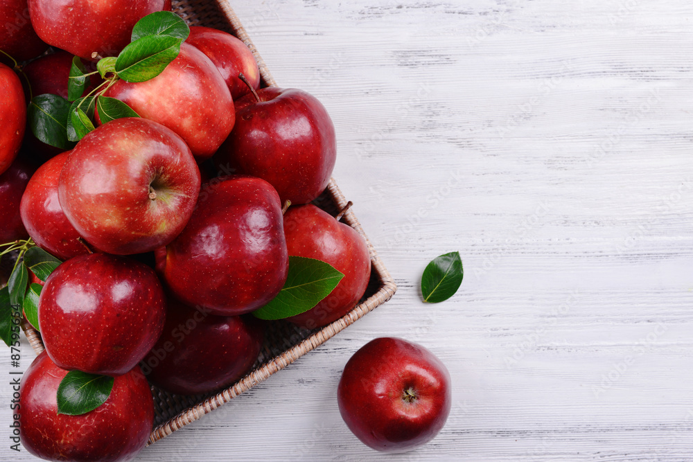 Ripe red apples in crate on wooden background Ripe red apples in crate on wooden background