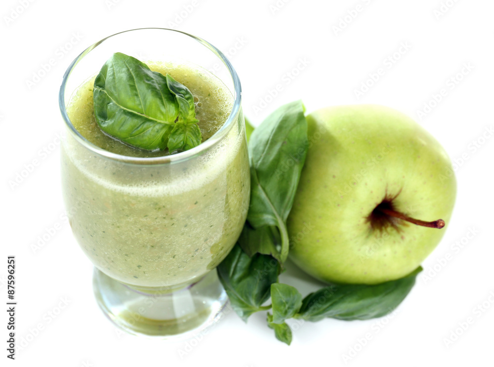 Glass of green healthy juice with basil and apple isolated on white Glass of green healthy juice with basil and apple isolated on white