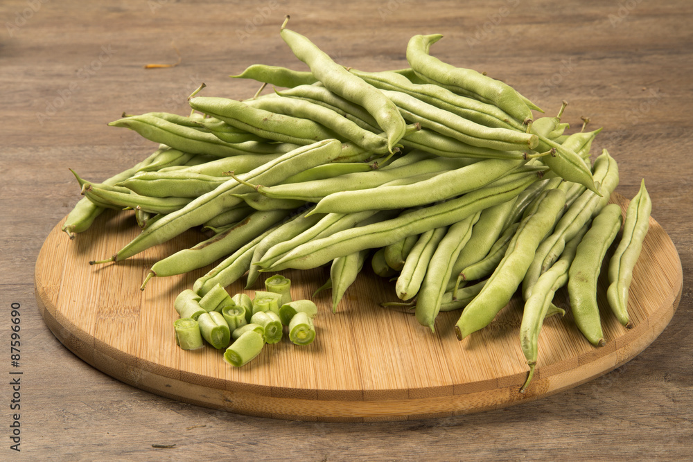 small and slender green beans (haricot vert) on a wood small and slender green beans (haricot vert) on a wood