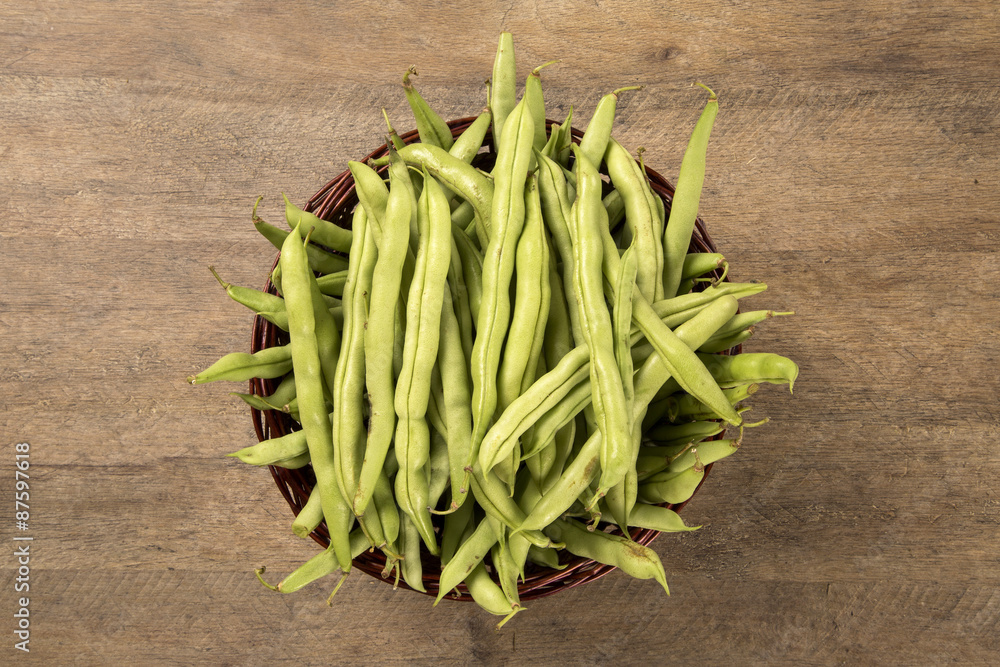 small and slender green beans (haricot vert) on a wood small and slender green beans (haricot vert) on a wood