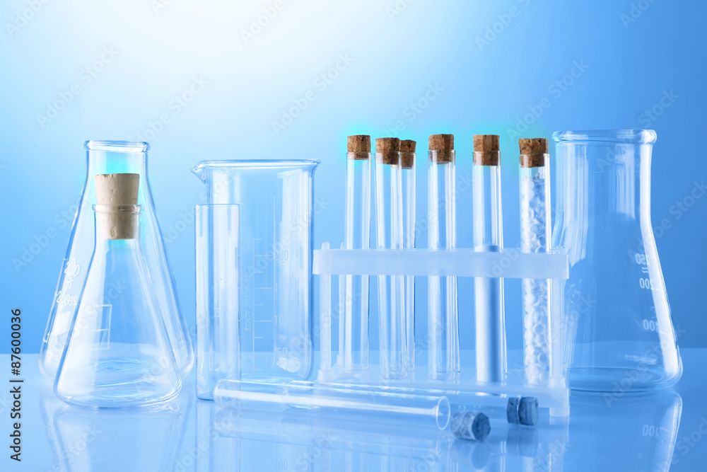 Empty laboratory test tubes on blue background Empty laboratory test tubes on blue background