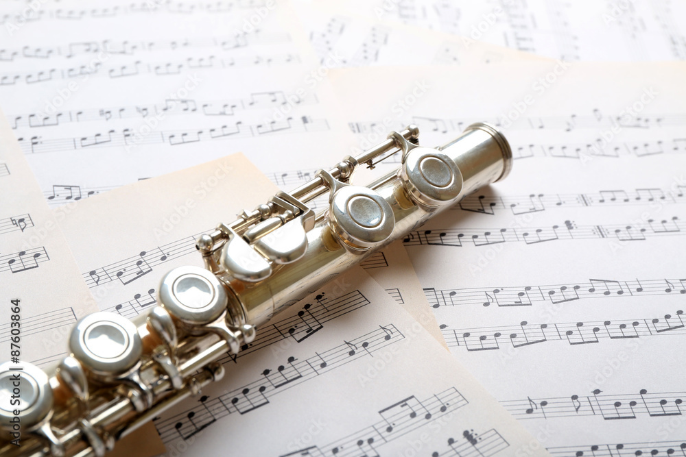 Fototapeta premium Flute on music notes background