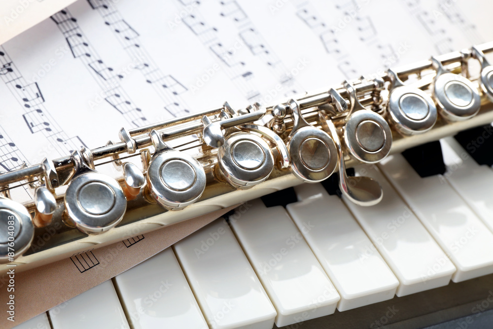 Fototapeta premium Flute and piano with music sheet close up