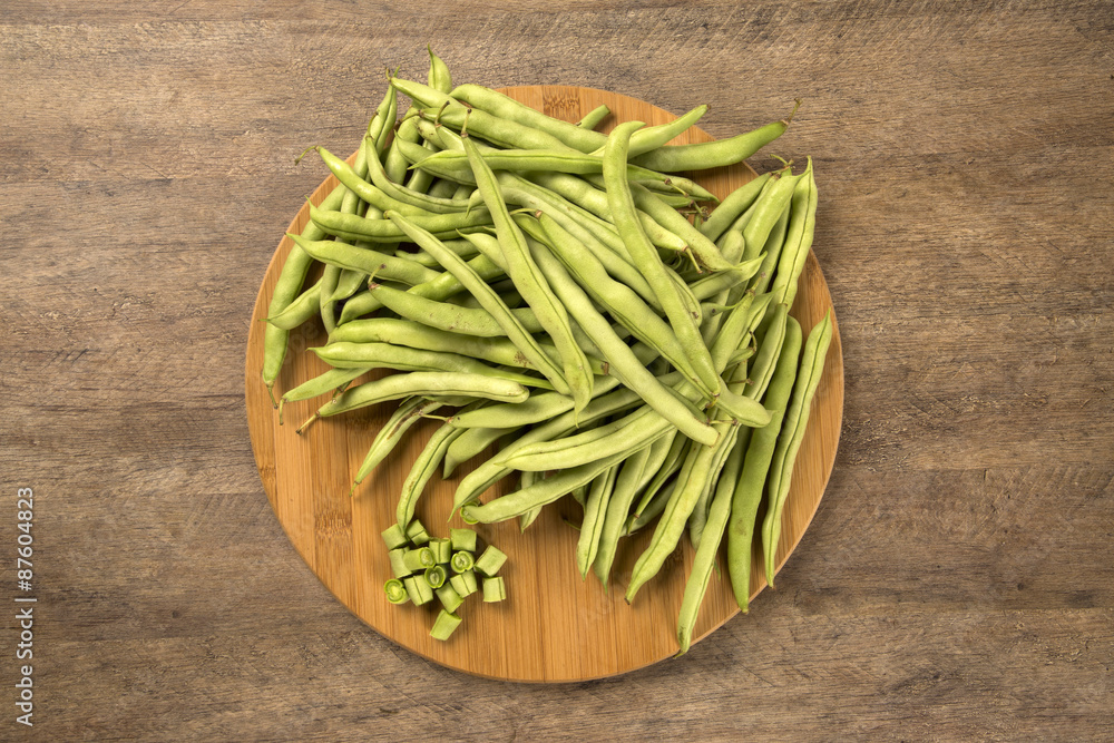 small and slender green beans (haricot vert) on a wood small and slender green beans (haricot vert) on a wood