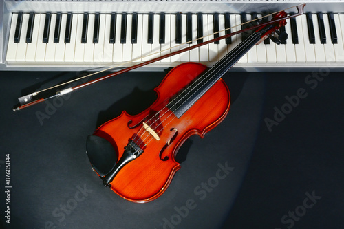 Violin and piano on dark background