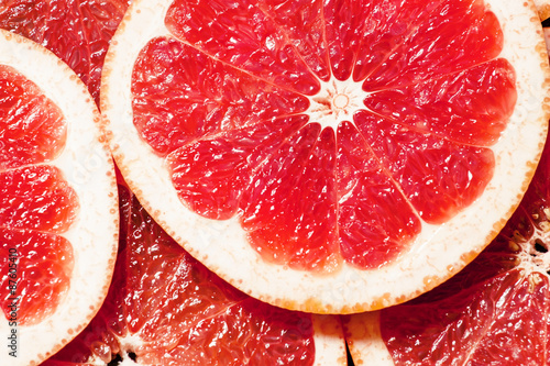 Slices of red grapefruit  top view  selective focus