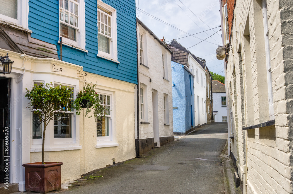 Narrow Street Lined with Colourful Buildings in a Fishing Village in Cornwall