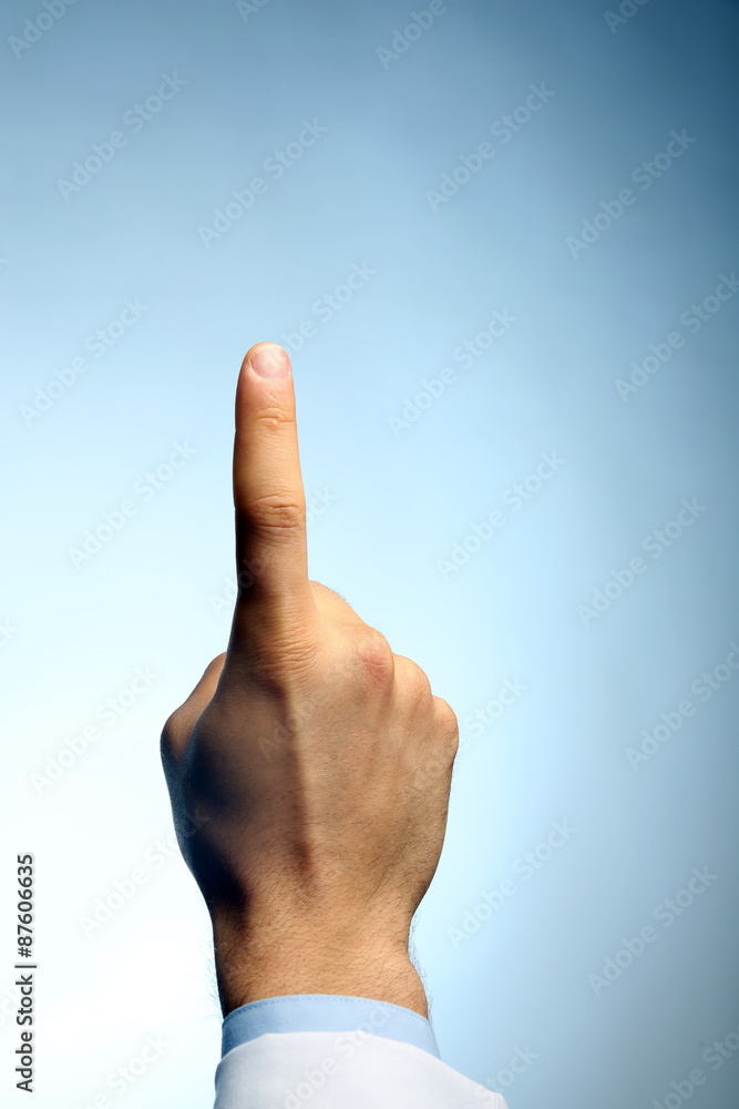 Doctor hand showing sign on blue background Doctor hand showing sign on blue background