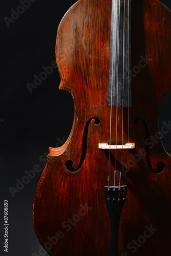 Vintage cello on dark background