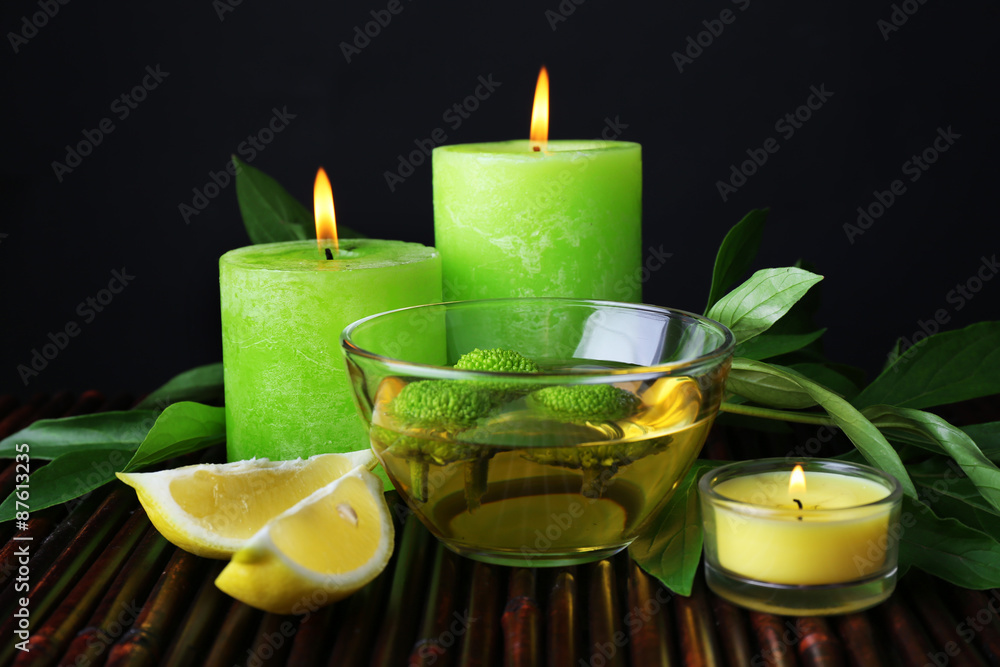 Spa still life in green color on bamboo mat, closeup Spa still life in green color on bamboo mat, closeup