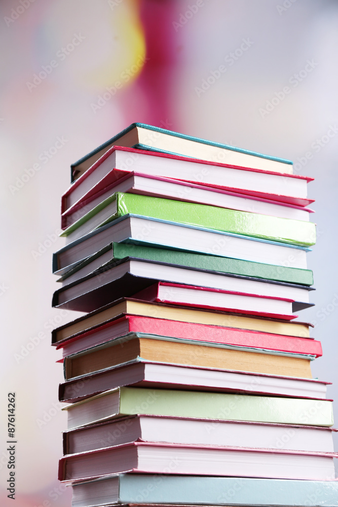 Stack of books on bright background Stack of books on bright background