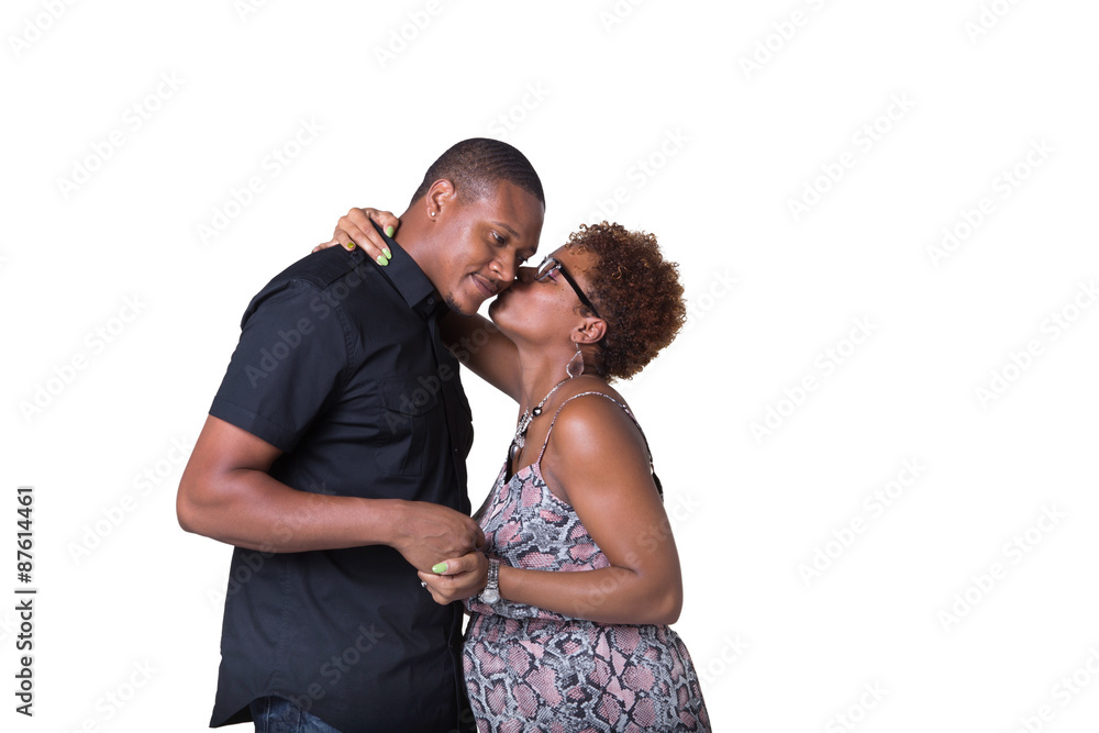 Portrait of an expecting African American couple kissing Portrait of an expecting African American couple kissing