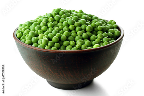 Fresh green peas in bowl isolated on white © Africa Studio