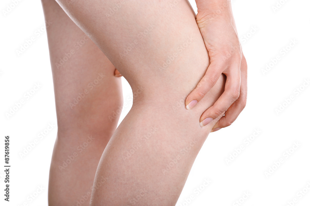 Young woman with knee pain isolated on white Young woman with knee pain isolated on white