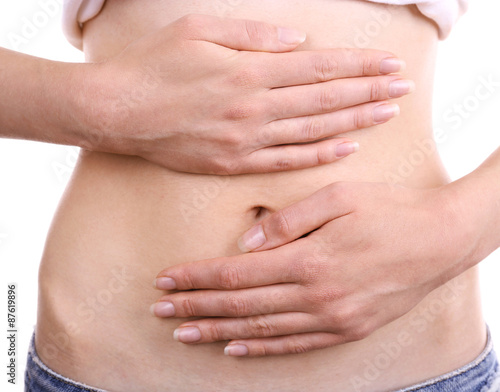 Wallpaper Mural Young girl with abdominal pain close up Torontodigital.ca