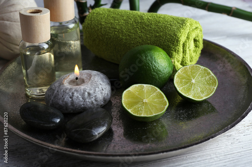 Beautiful composition of spa treatment on tray, on light background