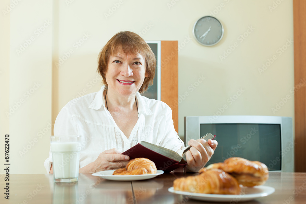  mature  woman having breakfast