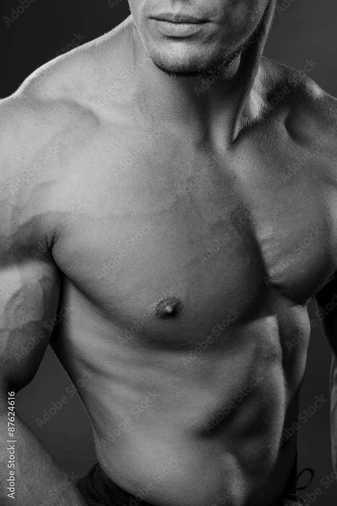 Bodybuilder showing his back and biceps muscles, personal fitnes Bodybuilder showing his back and biceps muscles, personal fitnes